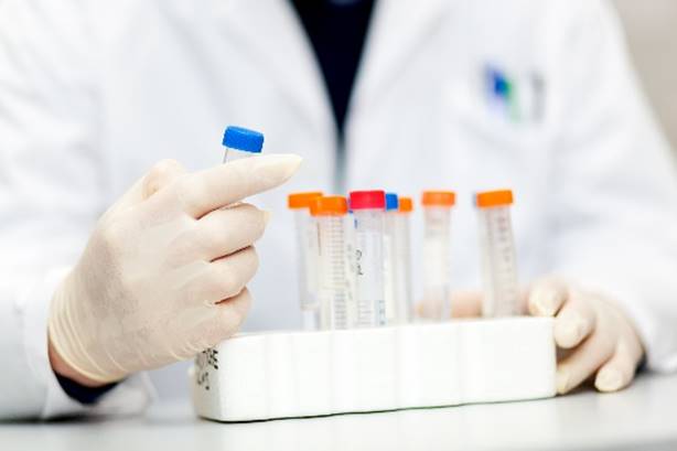 laboratory staff holding a test tube