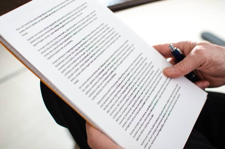 Close-up of hands holding paper