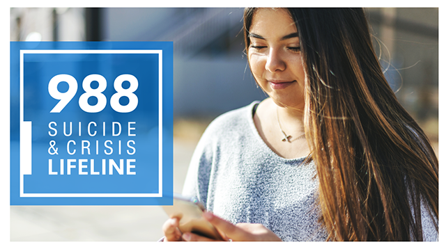 988 Suicide & Crisis Lifeline; Young woman with long hair looking at her mobile device.