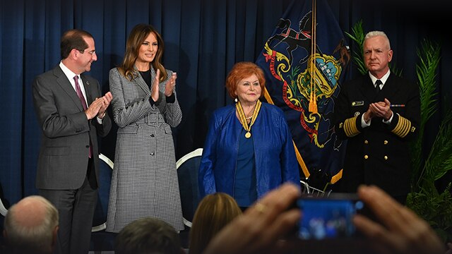 First Lady Melania Trump, Secretary Alex Azar, Assistant Secretary for Health Adm. Brett Giroir and an honoree at the National Convening on Neonatal Abstinence Syndrome