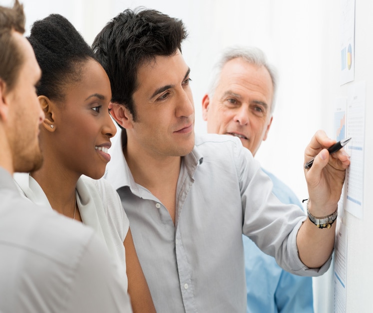 Business Team Analyzing Graph