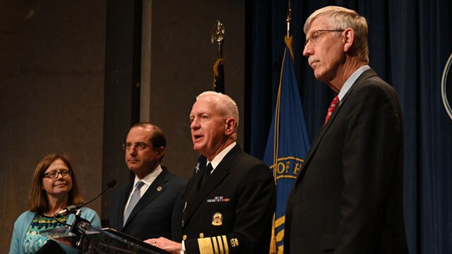 Assistant Secretary Brett Giroir speaks at a press conference at HHS, standing on a stage with others