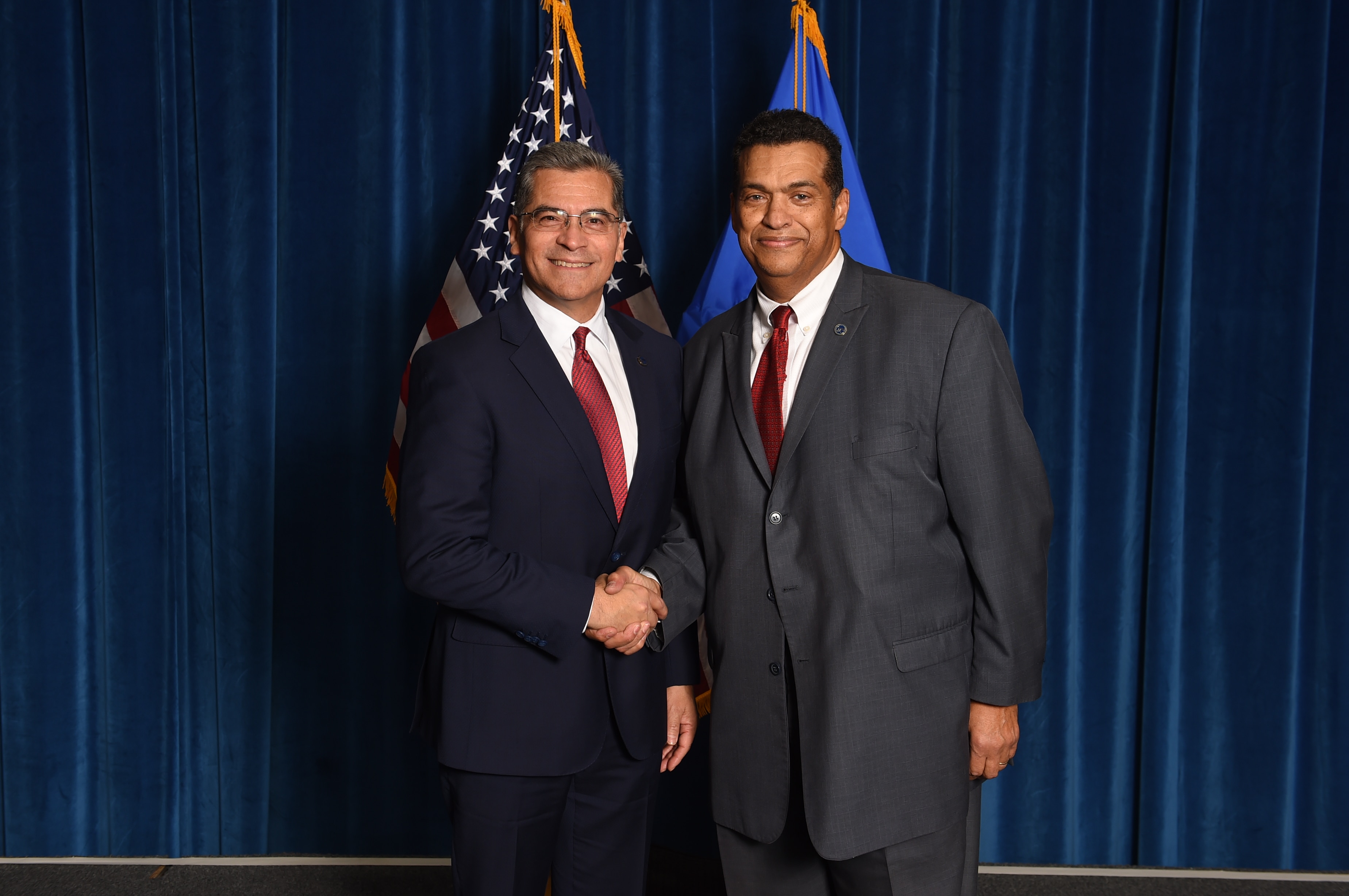 Pictured here: Secretary Becerra and Chris Smith posing at the 2022 staff holiday party.