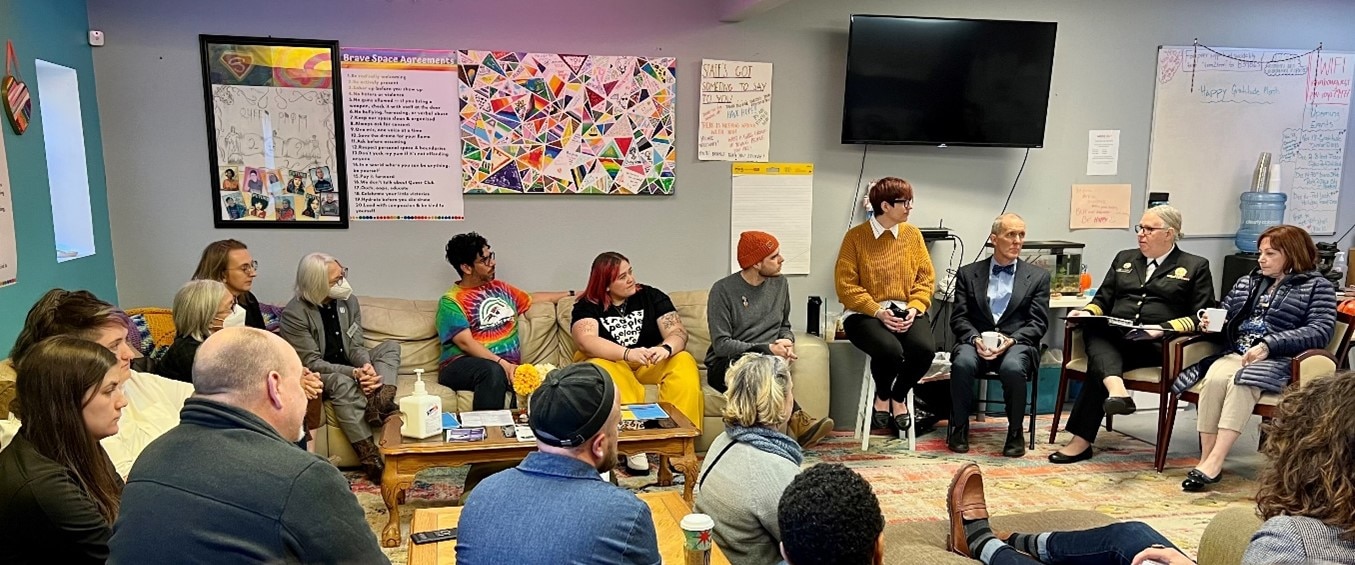 A group of people sitting in a room