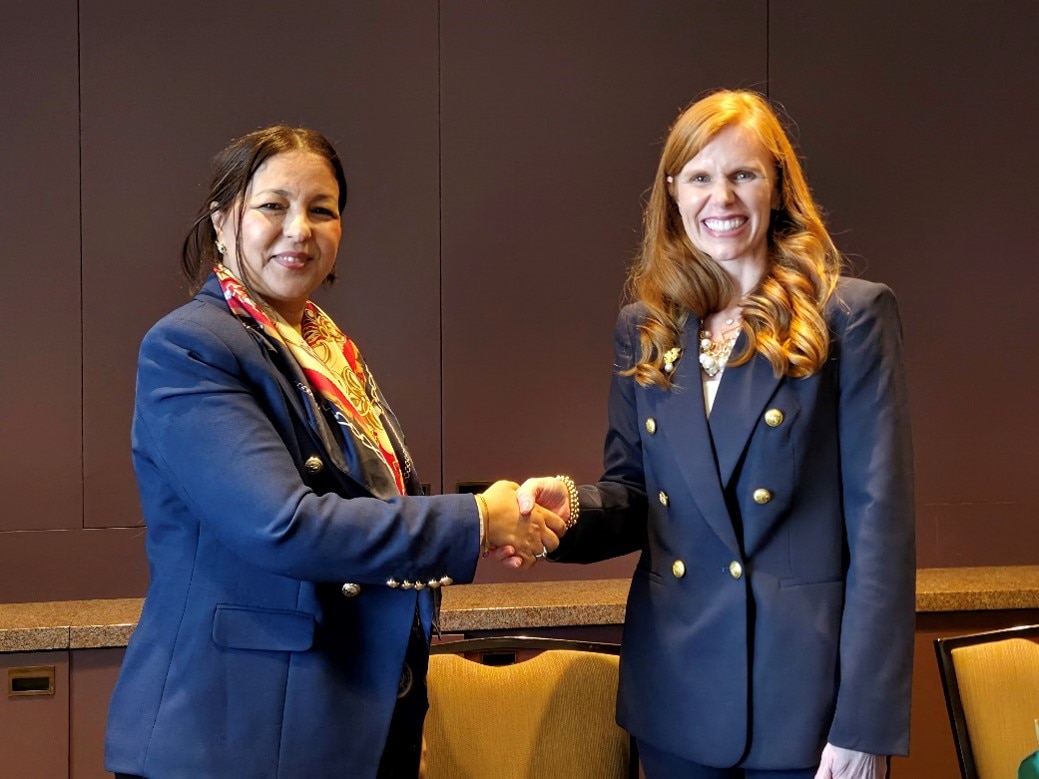 General Director of Multilateral Relations at the Ministry of Foreign Affairs, Baya Bensmail signs the Geneva Consensus Declaration on behalf of Algeria, alongside Director Bethany Kozma, Geneva Consensus Declaration Secretariat.