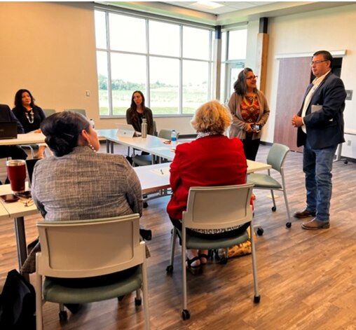 HHS Region 8 Regional Director pictured with representatives from state, Tribal, and community leaders in North Dakota to discuss the Biden-Harris Administration's mental health, access to care, and health equity work, specifically its work focused on Tribal and rural areas