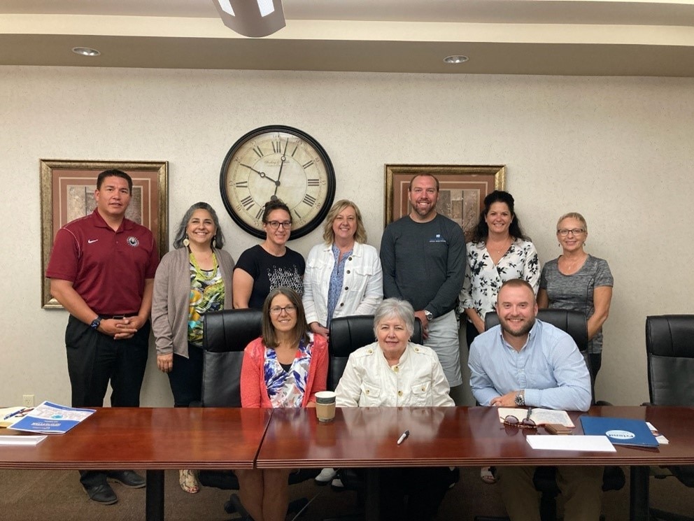 HHS Region 8 Regional Director pictured with representatives from state, Tribal, and community leaders in North Dakota to discuss the Biden-Harris Administration's mental health, access to care, and health equity work, specifically its work focused on Tribal and rural areas