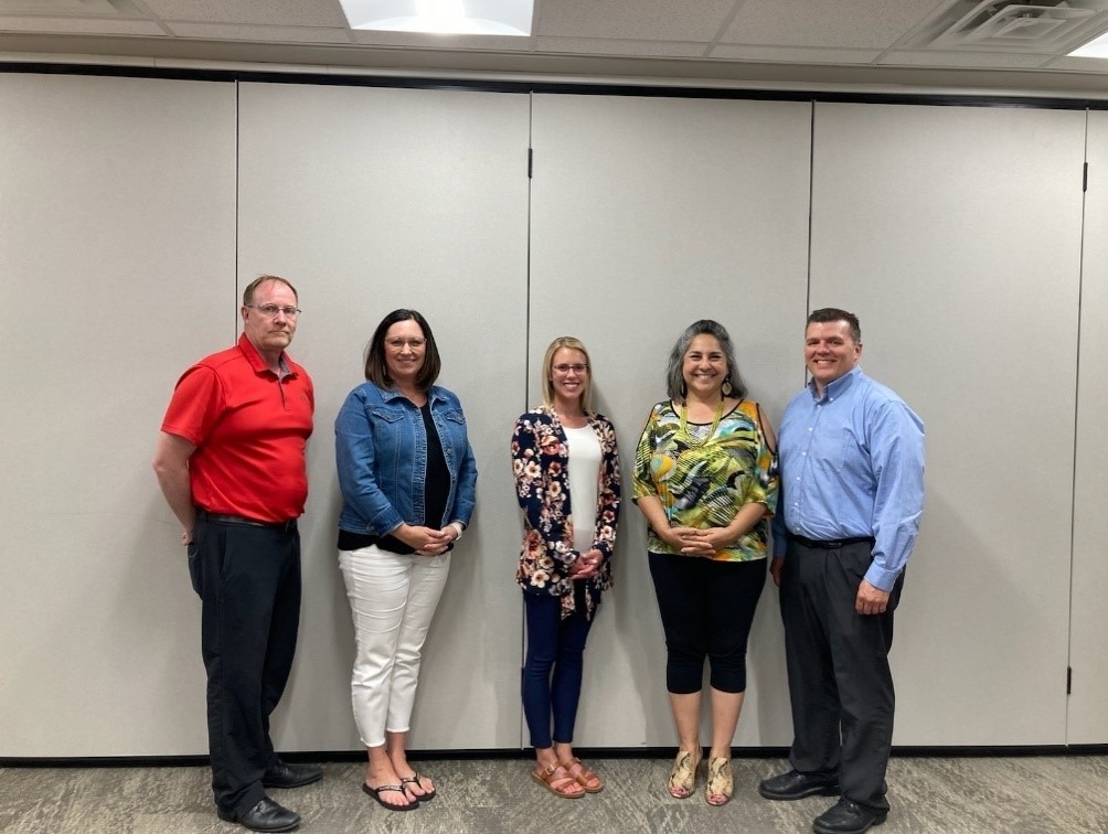 HHS Region 8 Regional Director pictured with representatives from state, Tribal, and community leaders in North Dakota to discuss the Biden-Harris Administration's mental health, access to care, and health equity work, specifically its work focused on Tribal and rural areas