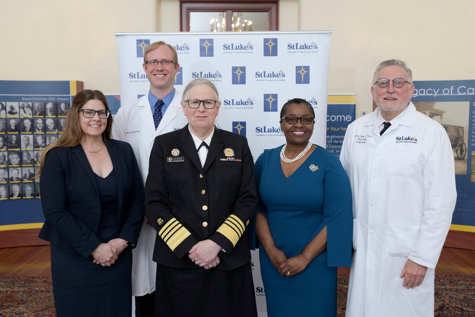 Group photo with Assistant Secretary for Health Admiral Rachel Levine in front of a step-and-repeat backdrop at St. Luke's University Hospital