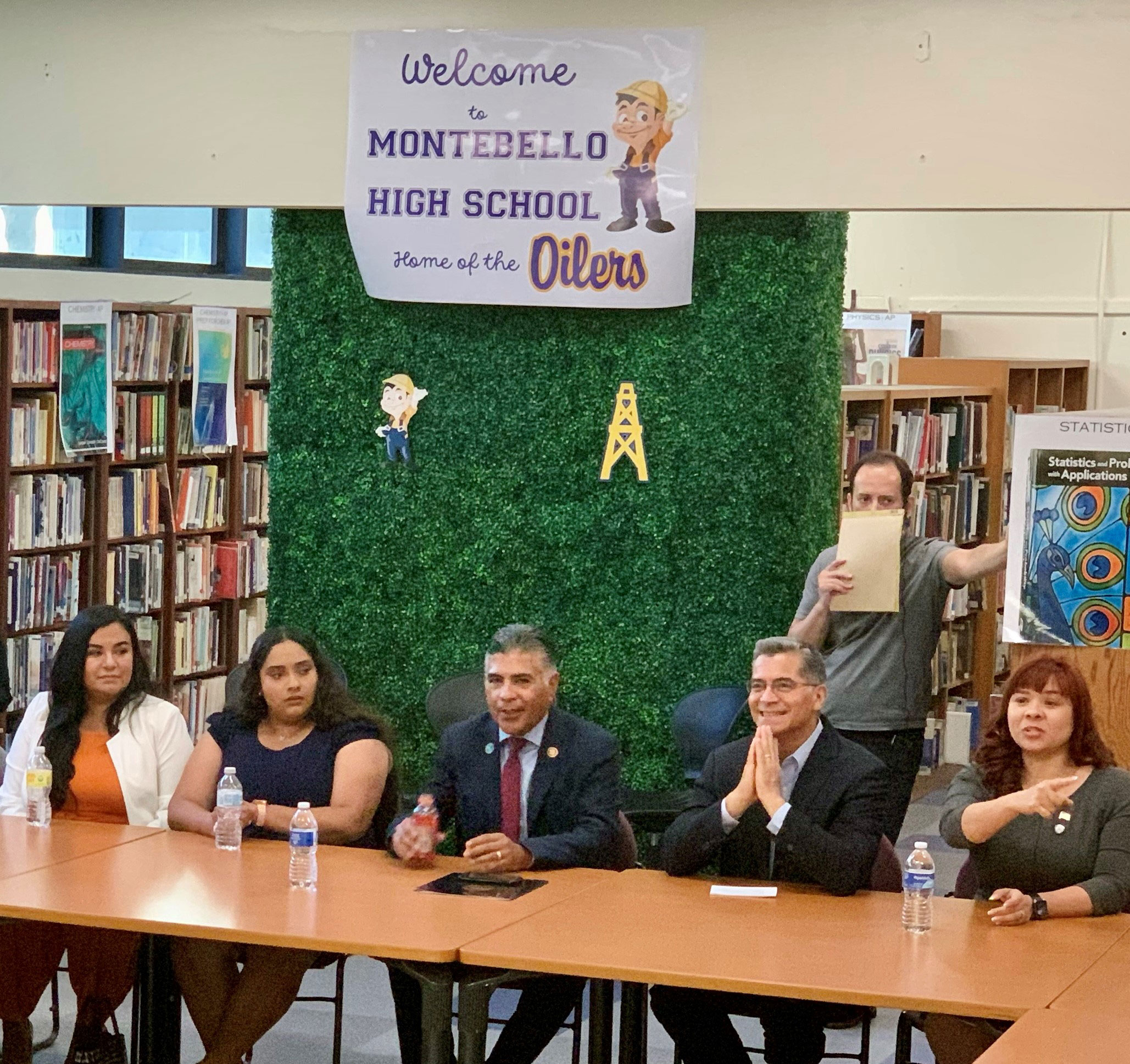 Secretary Becerra with students and parents at a high school.