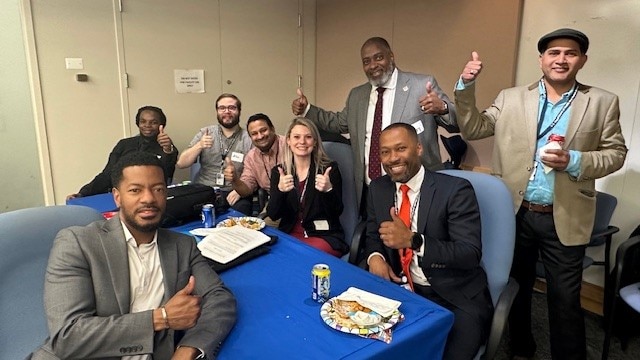 Avery Q. Muse, Sr. and staff from OCIO’s Office of Operations (Ops) giving a thumbs up for the amazing food and camaraderie.