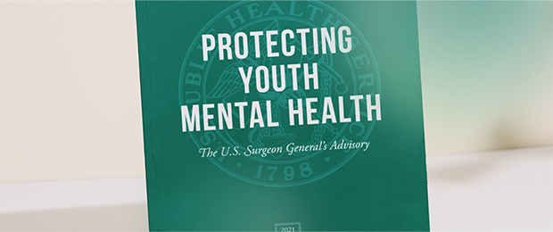 The cover of the U.S. Surgeon General's Advisory on Protecting Youth Mental Health has an official seal for the Public Health Service on a green background. The U.S. Public Health Service logo is centered in white.