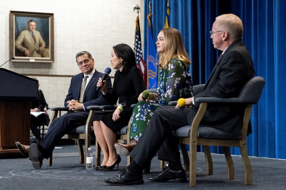 Secretary Becerra sits next to leaders from HHS partners Feeding America, Instacart, and Rockefeller Foundation. 