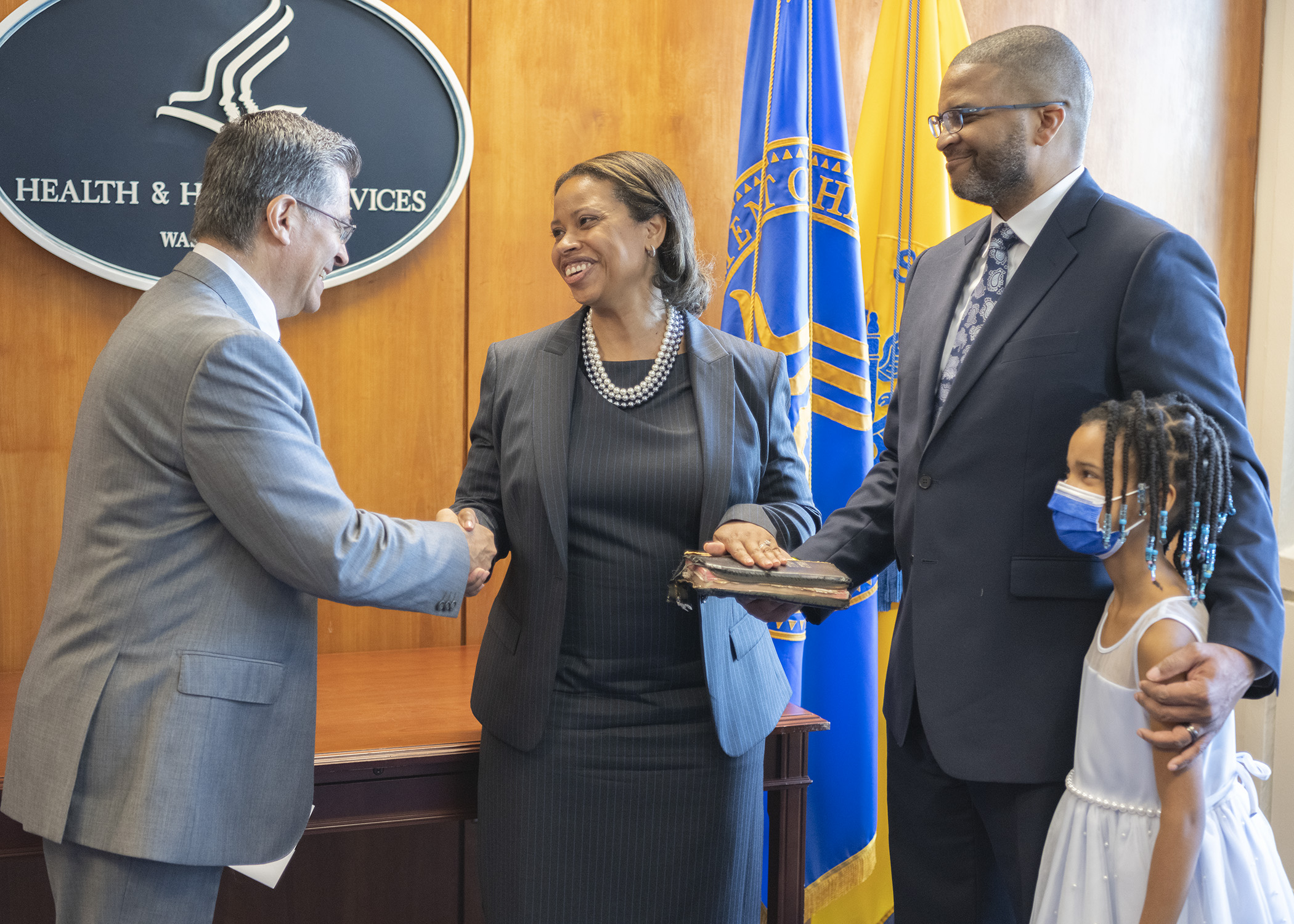 HHS Secretary Becerra shaking hands with CMS Administrator Chiquita Brooks-LaSure