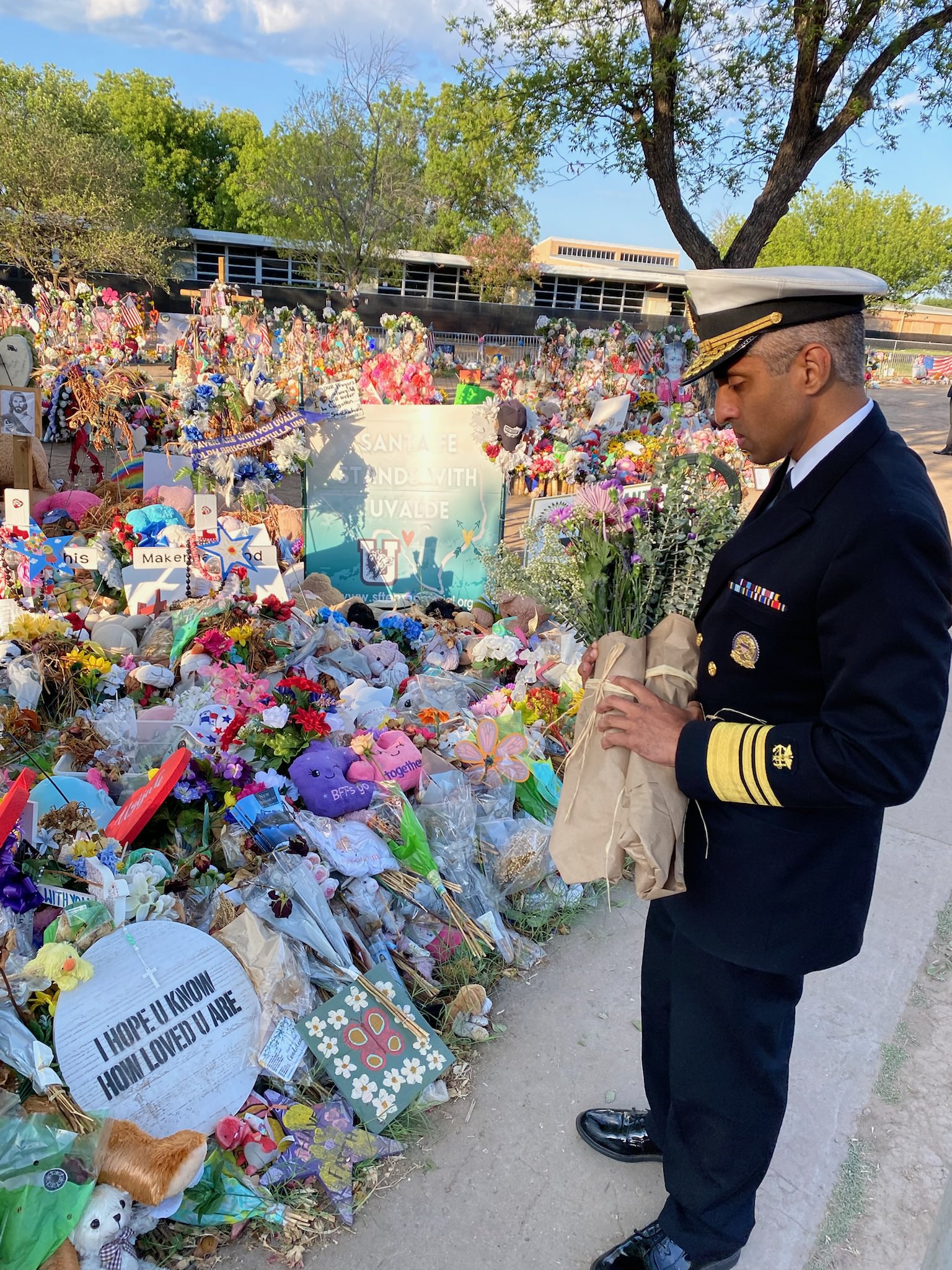 Surgeon General Vivek Murthy visits the memorial at Robb Elementary School in Uvalde Texas.